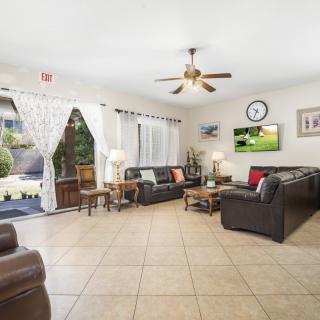 A spacious living room with comfortable seating and modern decor.