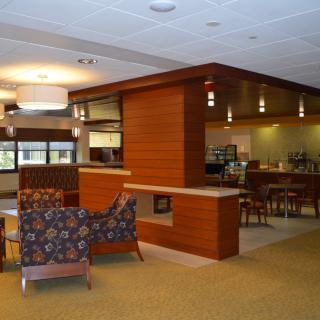 A modern lounge area with comfortable seating and ambient lighting.