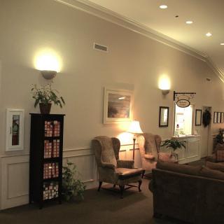 A cozy lounge area with comfortable seating and warm lighting.