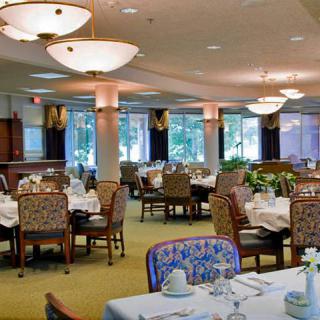 Spacious dining area with elegant decor and neatly arranged tables.