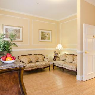 A cozy living room with elegant furnishings and warm decor.