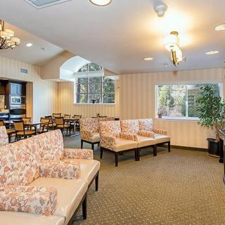 A cozy waiting room with ample seating and natural light.