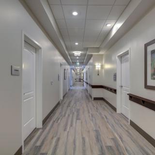 A modern and clean hallway in a healthcare facility.