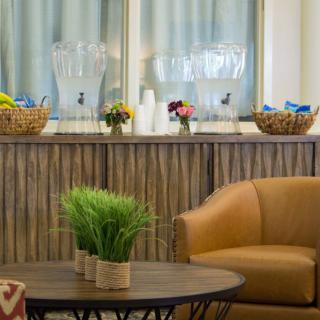 A cozy lobby area with comfortable seating and refreshments available.