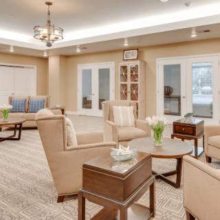 A modern and cozy living room with comfortable seating, elegant lighting, and tasteful decor.