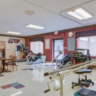 A well-equipped gym for physical therapy and rehabilitation exercises.