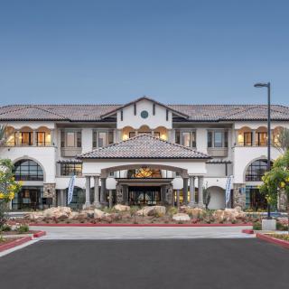 A luxurious residential building with a grand entrance and elegant facade.