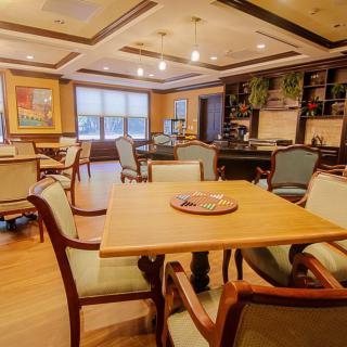 Elegant dining room with stylish furniture and warm lighting.