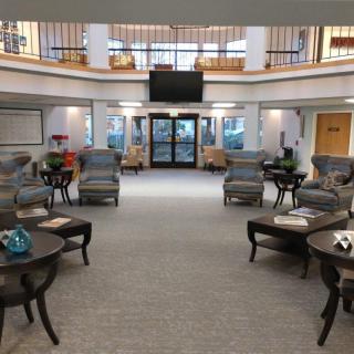 A spacious lobby with comfortable seating and elegant decor.