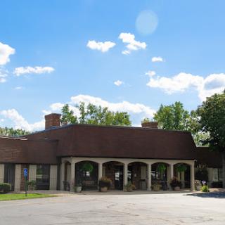 A picturesque view of a building set against a bright blue sky.