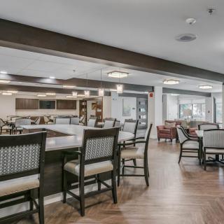 A spacious and modern dining area with comfortable seating arrangements.
