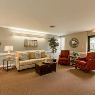 A cozy living room with comfortable seating and elegant decor.