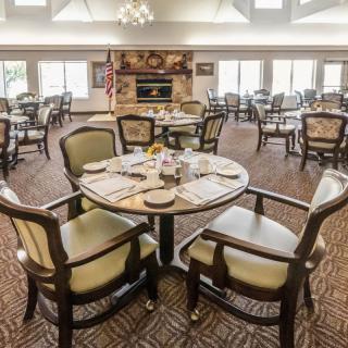 A well-arranged dining room with elegant tables and chairs.