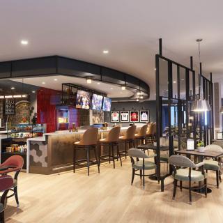 Modern bar and restaurant interior with sleek design and comfortable seating.