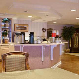 A cozy cafe with a well-arranged beverage station and inviting decor.