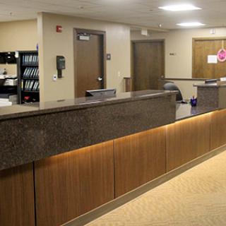 A modern reception desk in an office environment.