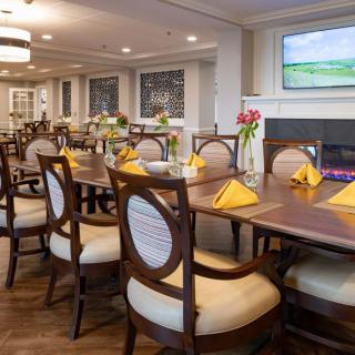 A beautifully arranged dining room with elegant furniture and vibrant decor.