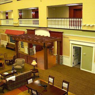 A spacious lobby with comfortable seating and decorative architecture.