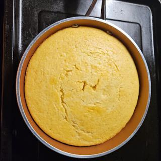 Freshly baked cornbread cooling in the pan.