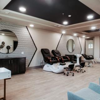 A modern spa interior with pedicure chairs and stylish decor.