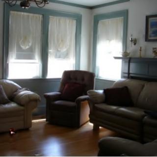 A cozy living room with comfortable seating and natural light.