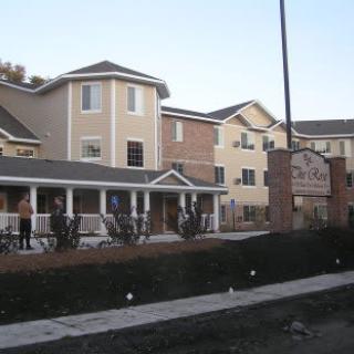 A residential apartment complex with multiple floors and diverse architectural features.