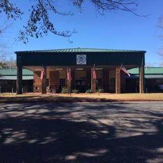 A view of a school building under clear blue skies.