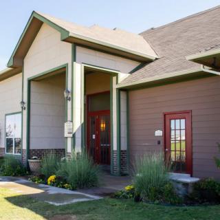 A modern residential house with a well-maintained garden and entrance.