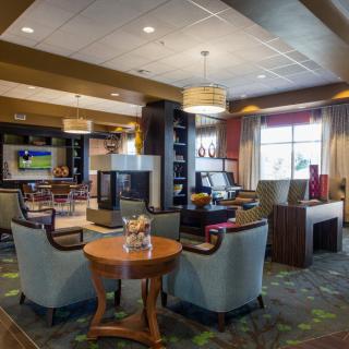 A modern hotel lobby with comfortable seating and stylish decor.