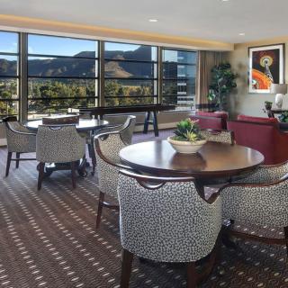 A luxurious dining area with a scenic mountain view through large windows.