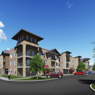 A modern apartment complex featuring multiple residential buildings with contemporary architecture.