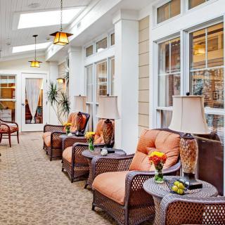 A cozy interior lounge with comfortable seating and decorative lamps.