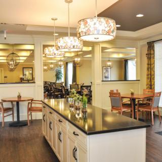 A modern dining area with elegant chandeliers and stylish seating arrangements.