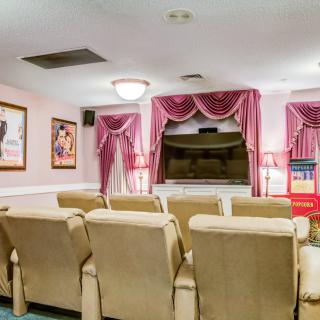 A cozy home theater with comfortable seating and classic movie decor.