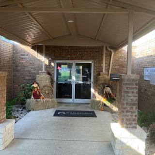 The welcoming entrance to a building, featuring decorative elements.