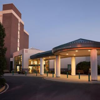 The inviting entrance of a modern building at dusk, showcasing contemporary architectural design.