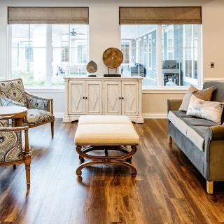 A modern living room with elegant furniture and abundant natural light.