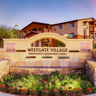 Entrance sign for Westgate Village Independent Retirement Living with landscaped surroundings.