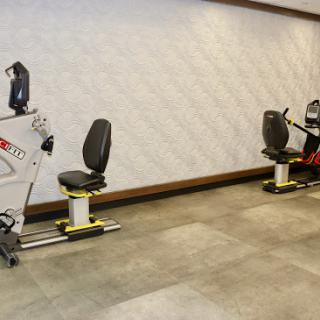 A view of rehabilitation exercise equipment arranged in a fitness space.