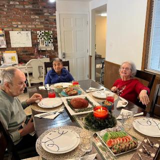 A cozy holiday dinner with loved ones, sharing joy and a festive meal.