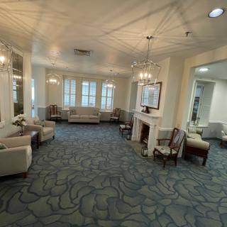 Spacious and elegantly furnished lobby with comfortable seating and bright lighting.