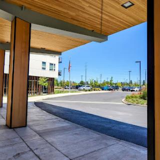 A well-designed entrance showcasing modern architecture and a clear blue sky.