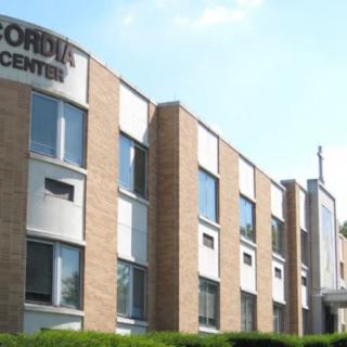 Exterior view of a center building under a clear sky.