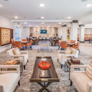 A spacious and elegantly decorated lobby with comfortable seating and modern furnishings.