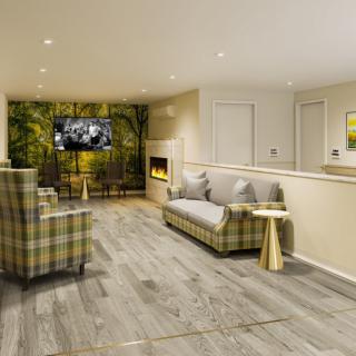 A cozy living room with modern furnishings and a fireplace.
