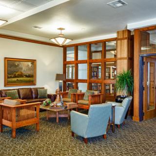 A cozy lobby area with comfortable seating and elegant decor.
