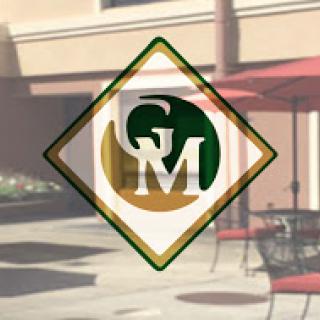 A stylized logo featuring green and gold colors, symbolizing a business identity.
