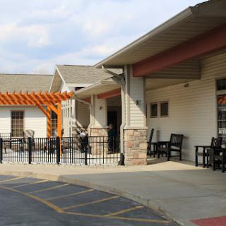 A modern building with an inviting outdoor seating area.