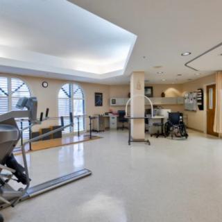 A spacious rehabilitation center equipped with exercise machines.