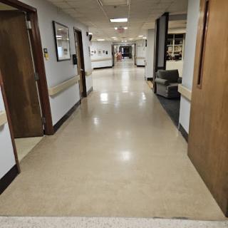 A view of a hospital corridor, showcasing the typical layout and design found in medical facilities.